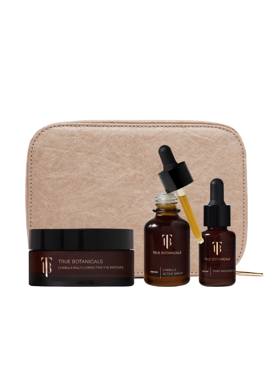 Skincare set with bottles, a jar, and a pouch on a white background