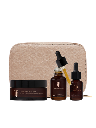 Skincare set with bottles, a jar, and a pouch on a white background