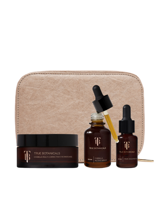Skincare set with bottles, a jar, and a pouch on a white background