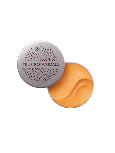 True Botanicals Everything Rescue Balm with open lid showing orange balm on a white background