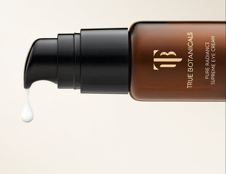 Cosmetic bottle with a dropper on a light beige background