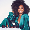Logan Browning with product assortment - True Botanicals 