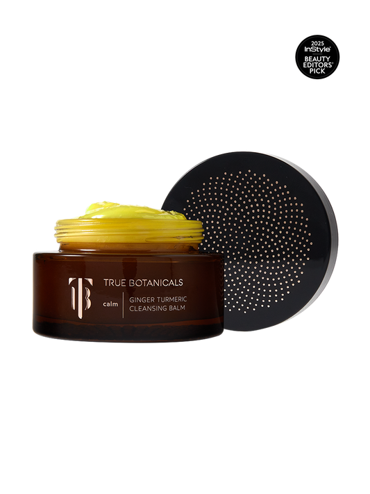 True Botanicals Calm Ginger Turmeric Cleansing Balm in a deep amber glass jar with a dark lid and gold logo, shown on a transparent background with an InStyle 2025 Beauty Editors' Pick badge.