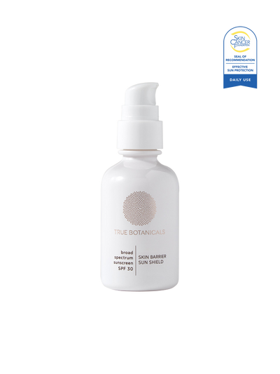 White bottle of True Botanicals sunscreen with a blue label on a white background