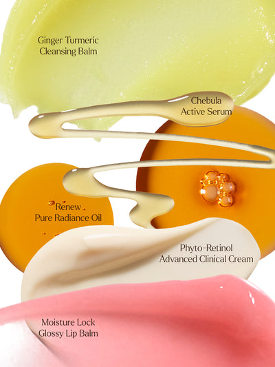 This vibrant visual highlights the luxurious textures of True Botanicals' essentials: the cleansing richness of Ginger Turmeric Cleansing Balm, the powerhouse hydration of Chebula Active Serum, the nourishing glow of Renew Pure Radiance Oil, the anti-aging strength of Phyto-Retinol Advanced Clinical Cream, and the smooth finish of Moisture Lock Glossy Lip Balm. Indulge your skin in every layer of care.