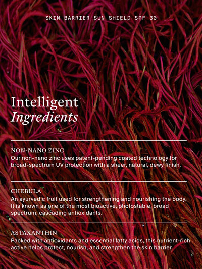A close-up product shot of a red and dark burgundy textured cosmetic or skincare ingredient blend, with white text overlays reading 'SKIN BARRIER SUN SHIELD SPF 30', 'Intelligent Ingredients', and ingredient descriptions for non-Nano Zinc, Chebula, and Astaxanthin.