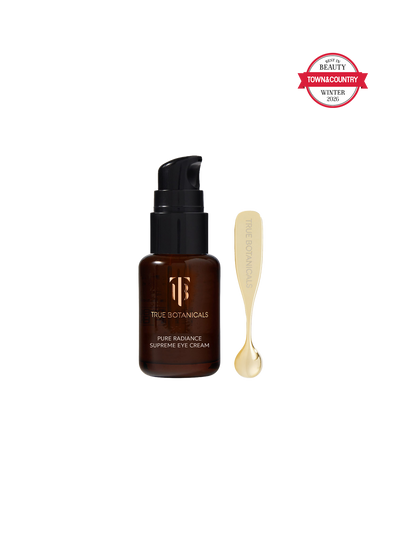 True Botanicals eye cream bottle with applicator on a white background