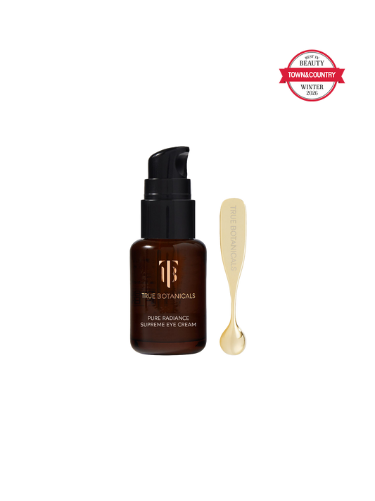 True Botanicals eye cream bottle with applicator on a white background