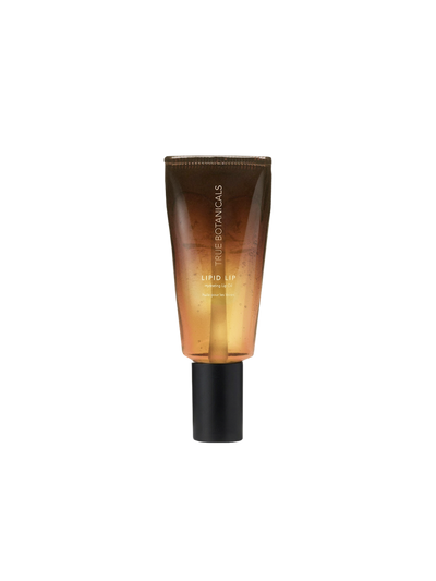 True Botanicals Lipid Lip Hydrating Lip Oil in a translucent tube with a warm amber-to-gold gradient and a matte black applicator cap.