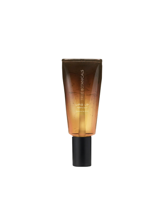 True Botanicals Lipid Lip Hydrating Lip Oil in a translucent tube with a warm amber-to-gold gradient and a matte black applicator cap.