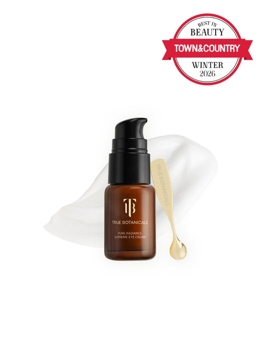Brown serum bottle with black cap on a white background, featuring Town & Country Beauty award.
