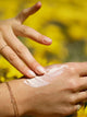Model rubbing in Skin Barrier Sun Shield SPF 30 True Botanicals - Thumbnail Image